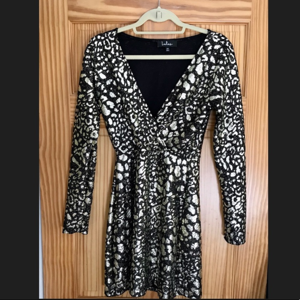 Metallic leopard print long sleeve dress. Runs big